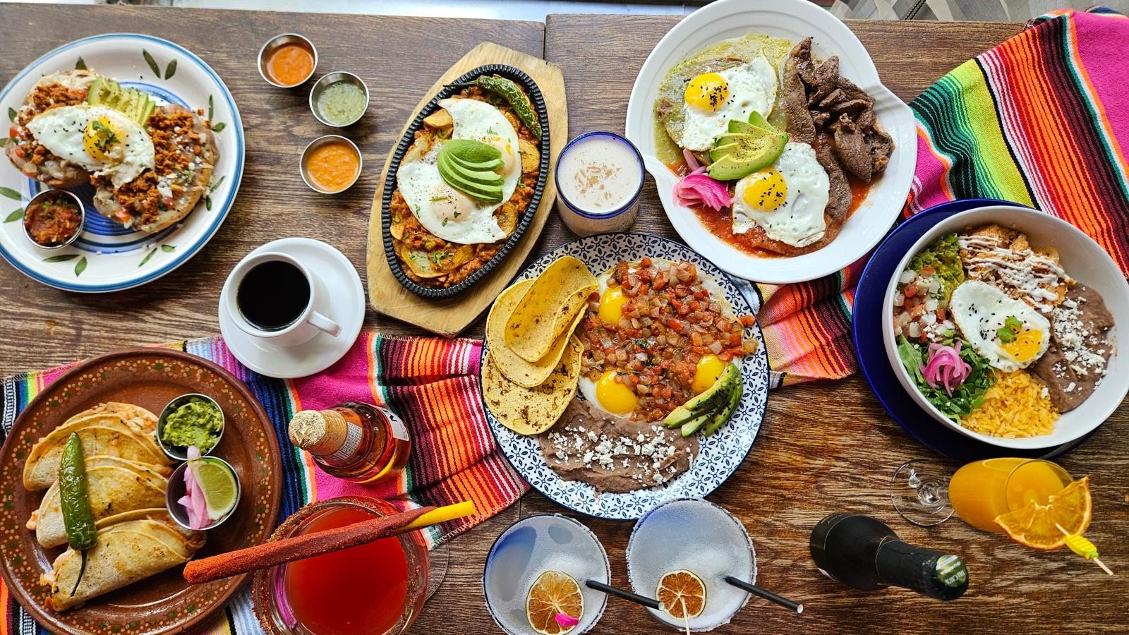 Chilaquiles smothered in green or red sauce with sour cream, feta, onion and egg