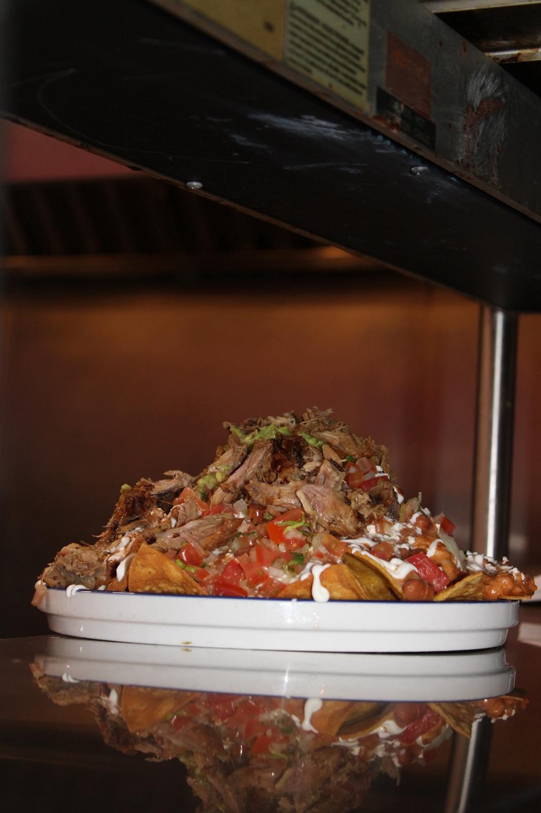 Tequila Cocina house nachos with chorizo, beans and pico